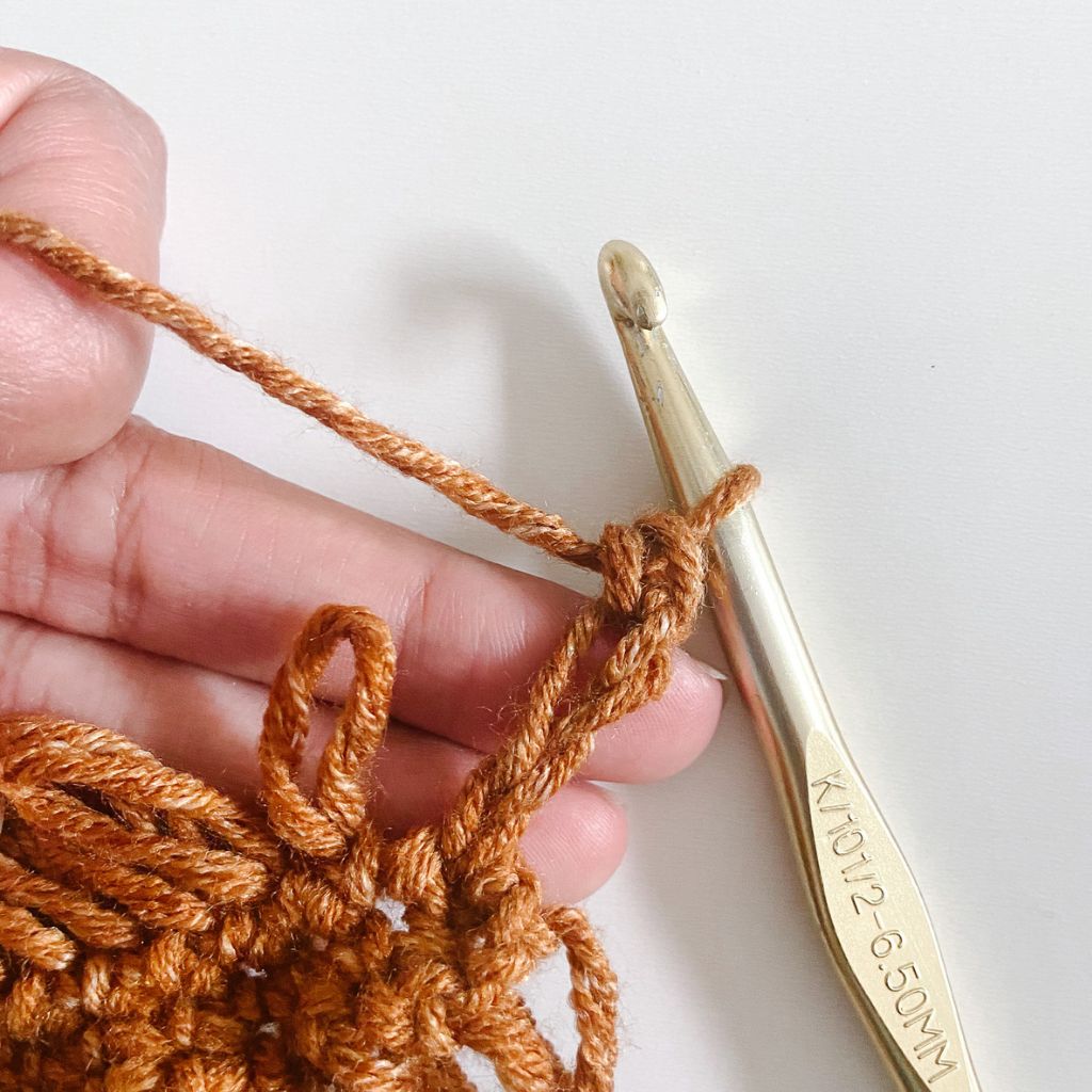 single crochet stitch in a drop stitch loop